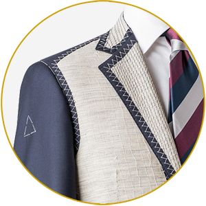 On better men's suits, there is layer of canvas between the fabric and the lining which allows the jacket to conform to your body. On cheap ones, the fabric and  lining are fused.