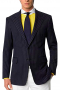 A two button, single breasted blazer with pressed high peak lapels including a boutonniere on the left lapel. This elegant office blazer stands out with its hand molded shoulders and rounded square bottom.