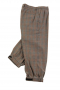 Handmade golf pants with a two-point button and hook closure waistband, slash pockets, two back pockets, and elastic cuffs.