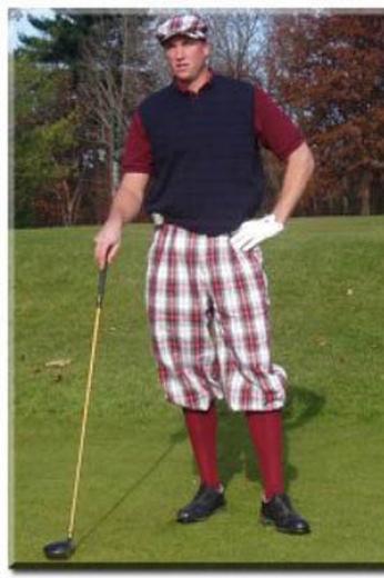 Mens traditional plaid flat front golf pants tailor-made with a baggy fit for mobility and slash pockets, a zipper fly, and elastic cuffs.