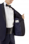 With refined features like a soft shoulder, sous bras, and shawl collar, this classic James bond style midnight blue tuxedo helps you get ready at a moment's notice for any formal affair. 