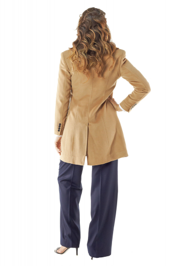 Handmade with cashmere, these tan winter overcoats are classy party-wear formals for working women. Front and back darts from shoulder seam to hems and slanted flapped lower pockets make these regal coats comfortable for everyday use too. They display a back center vent and four front buttons, two to close. Can be worn with casual denims for a semi-formal look.