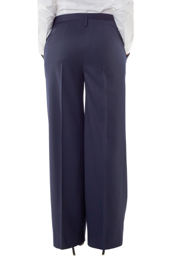 Dazzling hand tailored blue pants with flare legs and two vertical front pockets. A front zipper incorporated with two point hook buttons on the waistband for secure closure. Gorgeous hand sewn cuffs and hems for neat look.