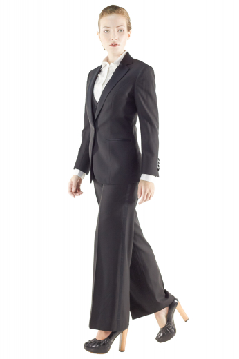 Exquisitely hot made to order black pant suits with figure defining V neck custom vests incorporating two welted lower pockets, four front closure buttons and angled V cut bottoms. Handmade sexy suit jackets with short length and two front buttons, also display satin facing notch lapels, four buttons on sleeves cuffs and double piped lower pockets. Custom tailored flare legs suit pants with flat fronts have extended buttoned waistband and zipper fly to close.