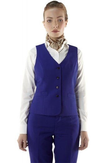 Glamorous custom tailored royal blue vests with adjustable buckles on the back for ultra slim fit. These made to order vests come with bespoke flash four front close buttons and two welted lower pockets. Handmade with wool and or cashmere, these vests look stellar with custom shirts and slim fit pants.