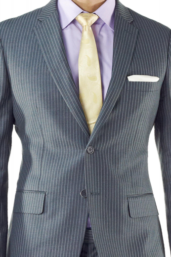 A bespoke men's single breasted slim cut two button suit jacket with made to measure rolled notch lapels, a tailored boutonniere, and tailor made hand molded shoulders.