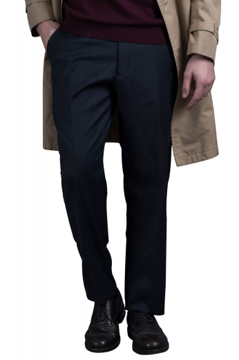 A pair of formal navy slim cut made to measure flat front suit pants with handmade front slash pockets, two tailored hand-sewn back pockets, and custom made extended belt loops.