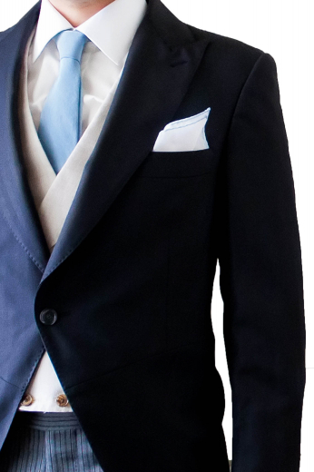 A made to measure single breasted one button rolled peak lapel suit jacket with a high gorge, paired with matching navy flat front pants with an extended three-point closure waistband with side adjustable tabs.