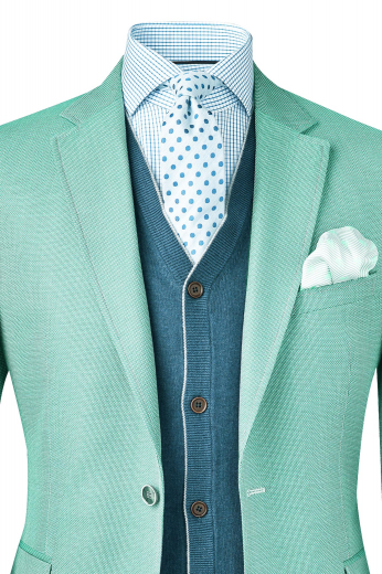 A handmade wool and cashmere blend blazer with a tailor made single-breasted, made to measure two-button high notch lapel design, custom tailored elegantly.

