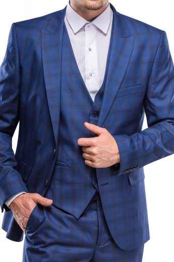 An exquisitely handmade three piece suit made up of a single breasted five button v-neck vest, a pair of matching flat front pants with slash pockets, all completed by a comfortably tailored single breasted two button suit jacket.