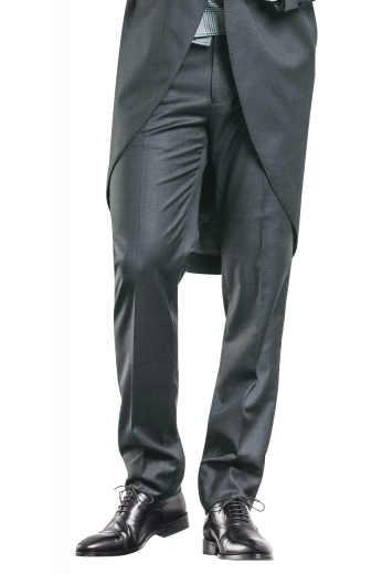 A handmade pair of elegantly sophisticated dark grey flat front suit pants made for a comfortable fit, these pants feature classic details such as slash pockets, a zipper fly, and hand-sewn cuff hems.