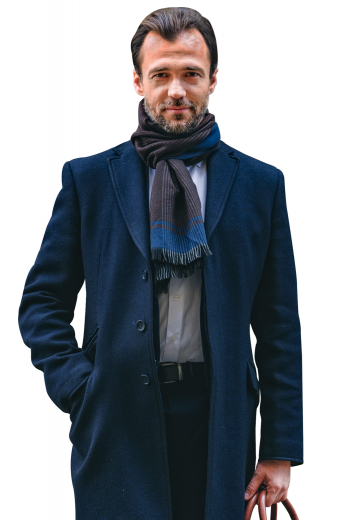 This super stunning mens tailor made midnight blue overcoat in cashmere wool ends just above the knees. With 3 inch wide high notch lapels and 3 covered front close buttons, this mens handmade midnight blue overcoat also features a classy center vent and 2 slanted lower pockets with flaps. You can buy this trendy mens custom made cashmere wool overcoat at My Custom Tailor where the weavers take extra efforts to hand stitch the edges of the lapels and pockets. 