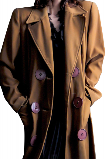 This womens custom made light brown wool overcoat is a treat for fashion lovers. With comfortable hand moulded shoulders and rounded lower patch pockets with flaps, this womens bespoke double breasted topcoat has 8 big purple front buttons, 3 to close. Buy this stunning womens tailor made wool overcoat at My Custom Tailor where weavers can also artistically hand stitch the edges of the pockets and lapels. 