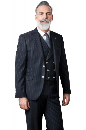 Step out with class in this custom made three-piece mens suit expertly tailored by professionals and composed of made to measure flat front pleat style pants with slash pockets, tailor made double breasted vests with square front and contrast buttons, and custom tailored single breasted jacket with two front buttons.