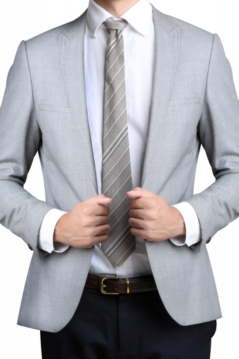 This single breasted mens handmade silver grey wool blazer is an elegant formal for board meetings and interviews. It puts forth a dazzling display of 2 1/2 inch wide peak lapels, 1 upper welt pocket, 2 lower pockets with flaps, a centre vent, and a one button front closure. It is made to order at My Custom Tailor with the freedom to customise the pockets and lapels to be hand stitched at the edges. Order online to make this mens bespoke blazer a part of your permanent collection of stylish blazers and sports jackets.