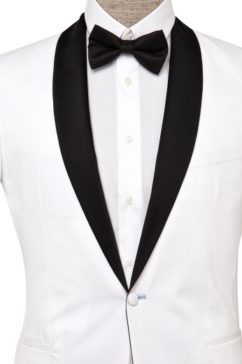 This men's white tuxedo jacket is custom made in a single breasted button closure, shawl collar and peak lapels. It is tailor made to measure to a perfect slim fit in a fine wool blend. This white dinner jacket would put Bond to shame!