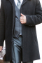 This men's black coat is perfect for all winter occasions, tailor made in a fine wool and tweed and cut to a slim fit, featuring a double breasted button closure, slanted welt pockets and buttoned cuffs. 