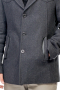 This men's charcoal coat is tailor made in a fine wool and tweed and cut to a slim fit, featuring a single breasted button closure and welt pockets. 