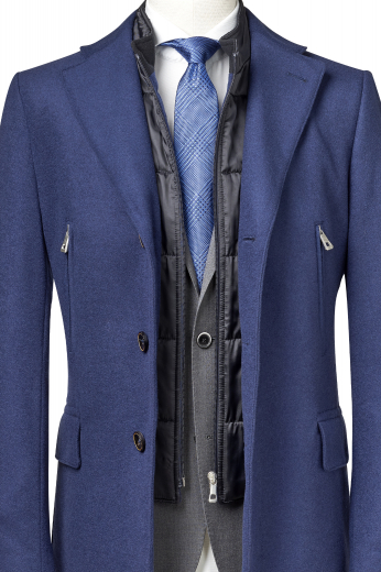 Style no.16506 - This men's dark blue coat is tailor made in a fine wool and tweed and cut to a slim fit, featuring a single breasted button closure and edge stitched pockets. It is a fashionable winter coat, sure to become a favorite in your winter wardrobe!