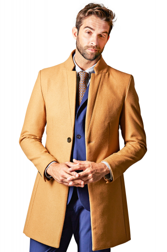 This men's bright, tan colored coat is tailor made in a fine wool and tweed and cut to a slim fit, featuring a single breasted button closure and landing just above the knee. 