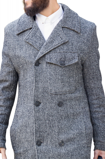 This men's custom made grey colored coat is tailor made in a fine wool and tweed and cut to a slim fit, featuring a double breasted button closure, slanted pockets, and edge stitched lapels. It is a classic winter coat, sure to become a staple in your everyday wardrobe!