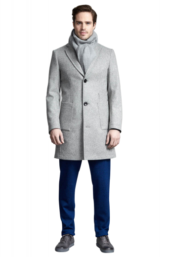 This men's custom made grey coat is tailor made in a fine wool blend and cut to a slim fit, featuring slash pockets, extended belt loops and a flat front pleat. It is a classic winter coat, sure to become a staple in your everyday wardrobe!
