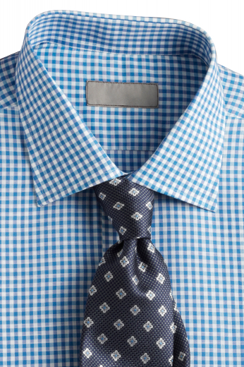 This men's slim cut, blue-and-white checkered button down is tailor made in a fine linen blend and features an semi spread collar and rounded barrel cuffs. It is cut to a perfect fit and is a fantastic option for any formal occasion!