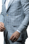 Very Modern Styled Business Mens Suit, Peak lapel, Slim fitting two button Jacket featuring flap pockets and side vents. Pants are flat front, slash pockets and one back pocket on right.  