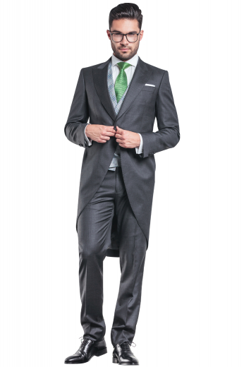 A hand tailored men's flattering formal jacket tailor made in a wool blend, featuring a single breasted button closure, peak lapels, and handstitched pockets paired with matching suit pants.