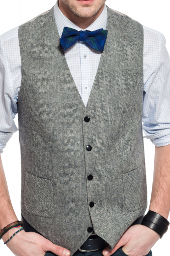 A stunning made to measure men's light grey slim cut vest is tailor made in a wool blend, featuring a single breasted closure and adjustable back buckle. 