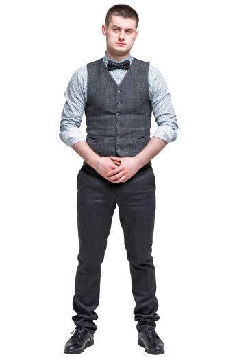 A custom bespoke men's hand tailored dark grey vest. This stunning men's vest is tailor made in a wool blend featuring a single breasted closure and v neck, with piped lower pockets. 