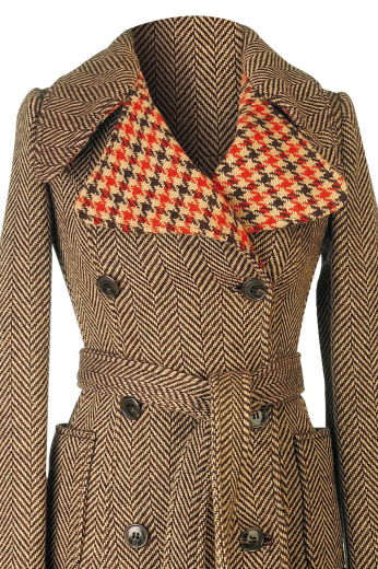 This women's outer coat is super stylish, featuring an gingham printed inner collar and double breasted button closure. It is sure to keep you fashionable yet comfortable all winter long. 