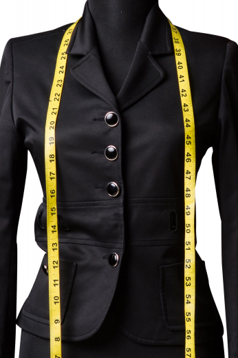 This custom made skirt suit features a pencil skirt with a modest center vent and a single breasted blazer, both beautifully made with careful attention to detail. 
