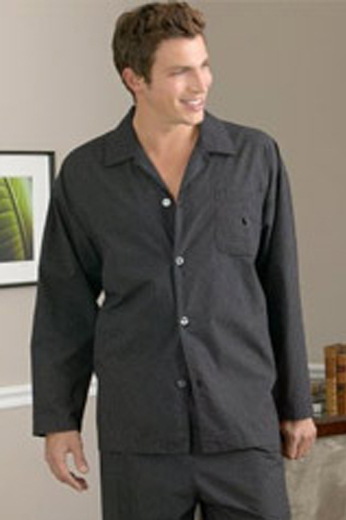 A tailor-made men's comfortably loose cut rounded bottom dark grey pajama button-down shirt with matching loose cut flat front pants with the elegant touch of on-seam pockets.