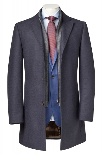 This elegant mens custom made dark grey wool overcoat is a perfect formal for an updated work look. This mens tailor made single breasted overcoat features 3 front close buttons and 3 1/2 inch wide track stitched notch lapels. This mens bespoke dark grey overcoat also features 2 on-seam track stitched lower pockets, 1 boutonniere on the left lapel, and a center vent. You can buy this mens handmade dark grey wool topcoat at My Custom Tailor at rates that you can afford.