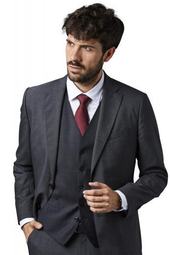 Custom Made Clothing This mens handmade dark grey three piece suit in cashmere wool is an absolute win for stylish men. It features an iconic slim fit pant with a zipper fly and a two point button and hook closure and a made to order mens slim fit vest with peak lapels, 2 welted lower pockets, and an upper welt pocket on the left. It also consists of a stunning mens bespoke suit jacket that is fabricated at My Custom Tailor to flaunt 2 notch lapels, 2 front close buttons, 2 lower flapped pockets, and 1 upper welt pocket.