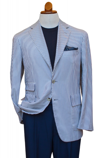 Mens Bespoke Linen Wool Black Stripe White Blazer This mens tailor made wool and linen mix blazer in white flaunts a stunning display of black vertical stripes all over. It is a single breasted formal festooned with a stylish centre vent, 2 front closure buttons, 2 3-inch-wide notch lapels, 1 upper welt pocket, 2 lower flapped pockets, and 1 elegant flapped ticket pocket on the right. Order online at My Custom Tailor where skilful fabric magicians can also hand stitch the edges of the pockets and lapels.