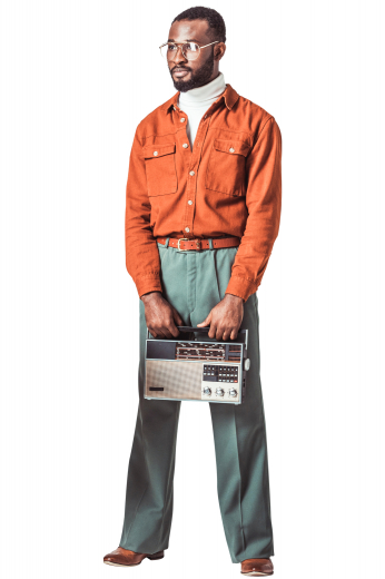 A custom loose tailored cut shirt made just for you in a great brick orange. This men's tailored shirt features an Ainsley collar, rounded barrel cuffs, and two flapped, buttoned pockets and a classic placket front, a plain back, and a standard yoke.