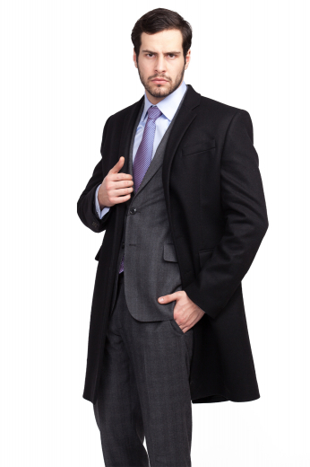 This men's black and grey pant suit is tailor made in a fine wool blend and cut in a slim fit, featuring notch lapels, single breasted button closures, and hand sewn cuffs.