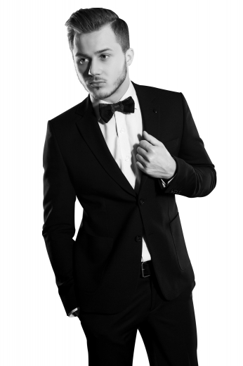 This men's pant suit is tailor made in a fine wool blend and cut to a slim fit, featuring a single breasted button closure, notch lapels, and slash pockets. 