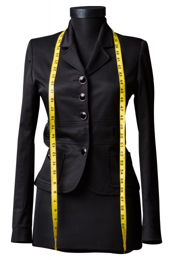 This custom made skirt suit features a pencil skirt with a modest center vent and a single breasted blazer, both beautifully made with careful attention to detail. 