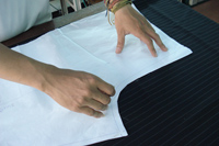 Paper Patterns are cut and overlaid on the fabric for all our custom pants